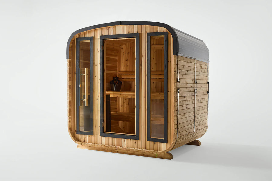 The Almost Heaven BlackWater 4 Person Cube Sauna is a compact, freestanding outdoor sauna with a curved roof, glass doors and windows, wooden benches, and a black heater—highlighting its cozy design against a plain white background.