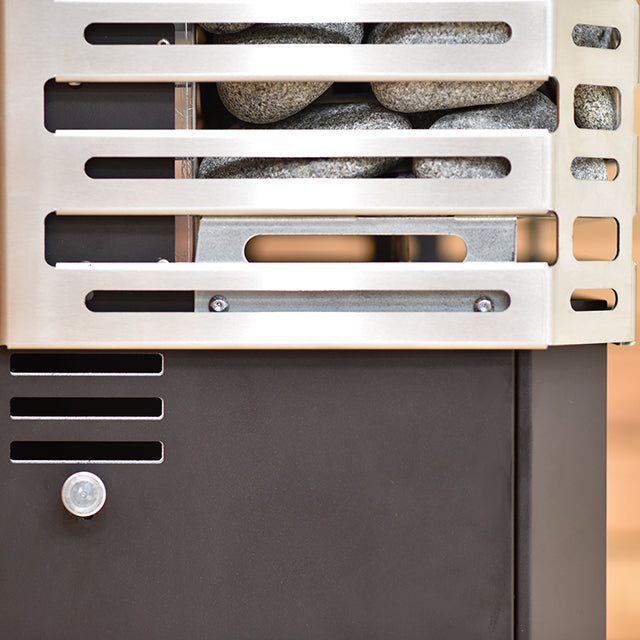 Close-up of the Saunum AIR L 15 WiFi Sauna Heater Package by Saunum, featuring smooth grey stones behind a vented stainless steel cover, matte black lower panel, and advanced air blending for optimal heat distribution.