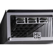 Close-up view of the HUUM CLIFF Mini Series 4kW Sauna Heater Package by HUUM, featuring a metallic heat sink with vertical fins and rectangular slots, designed for small home saunas. The HD logo appears on the surface.