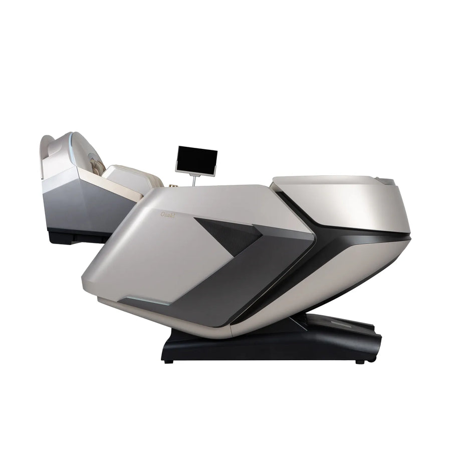 The Osaki Grand Duo 4D+4D Massage Chair features a sleek light gray and black design, advanced dual back massage technology, an AI health sensor, and a built-in control screen on a modern black base.