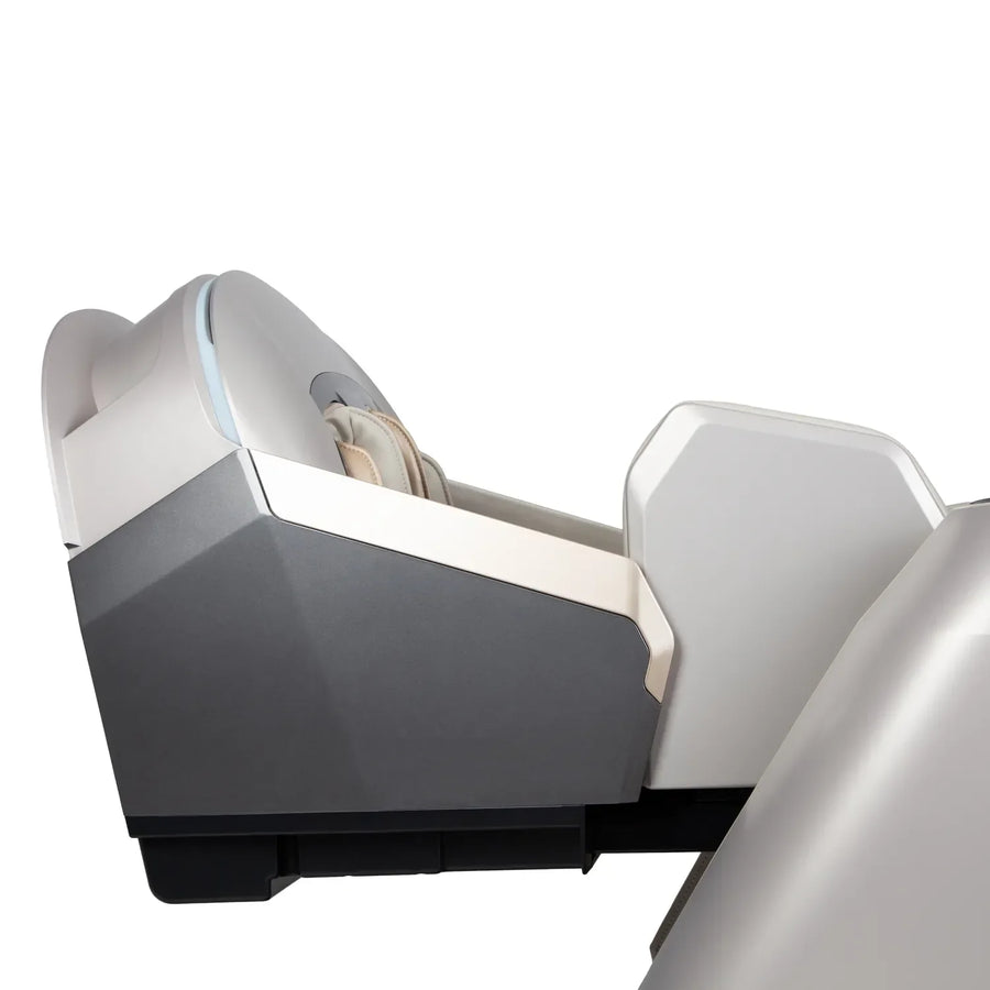 Side view of the Osaki Grand Duo 4D+4D Massage Chair by Osaki, featuring a sleek white and gray design. A user relaxes inside the chair’s contoured chamber, set against a plain white background.