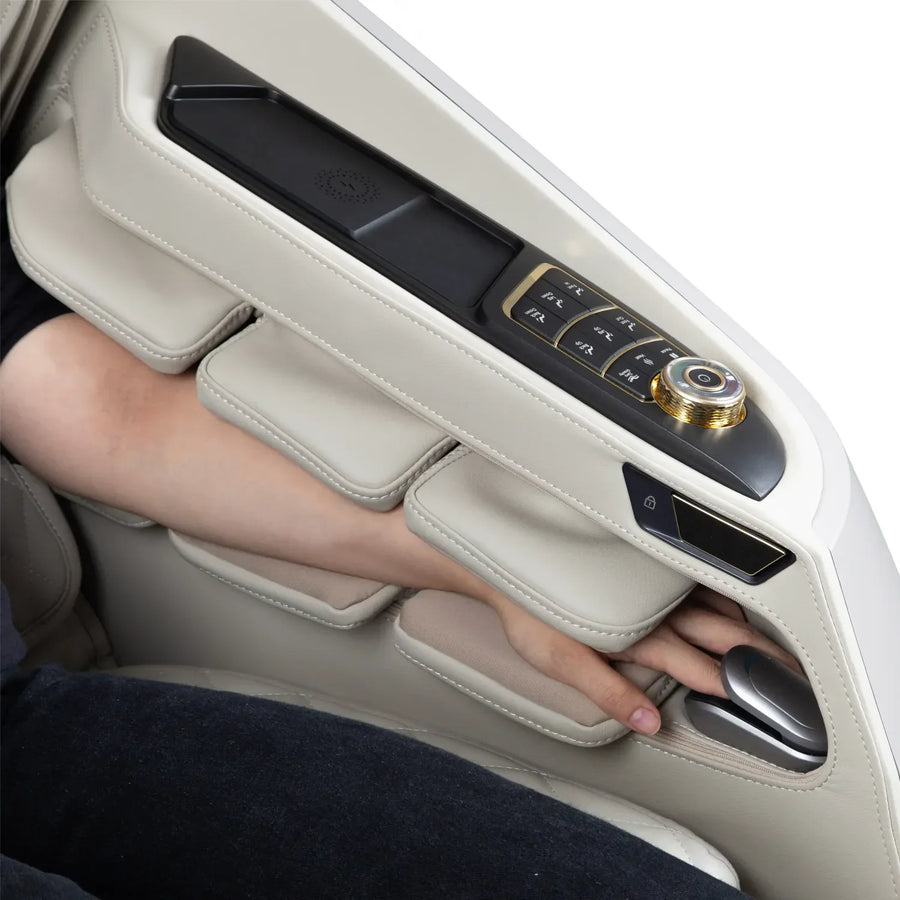 A person's arm is inserted through padded openings in an Osaki Grand Duo 4D+4D Massage Chair armrest, with buttons and a dial above, offering dual back massage and advanced AI health sensor features.