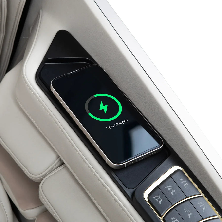An Osaki Grand Duo 4D+4D Massage Chair by Osaki features a green charging symbol and 75% charged indicator as a smartphone wirelessly charges on its integrated pad beside an AI health sensor and control buttons.