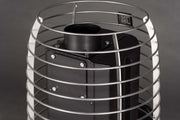 Close-up of the HUUM Hive Flow LS Wood Burning Sauna Stove by HUUM, featuring an eco-friendly rectangular body inside a cylindrical silver metal cage with horizontal bars, set against a plain gray background.
