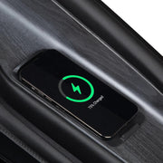A smartphone rests on a wireless charging pad in a car, showing a green battery icon and 75% charged. Its sleek, dark design mirrors the modern comfort of the Osaki 4D Orion Duo Mech Massage Chair by Osaki.