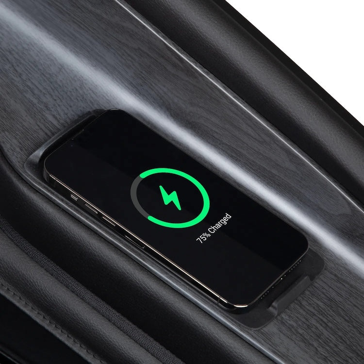 A smartphone rests on a wireless charging pad in a car, showing a green battery icon and 75% charged. Its sleek, dark design mirrors the modern comfort of the Osaki 4D Orion Duo Mech Massage Chair by Osaki.