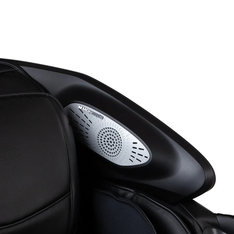 Close-up of a white speaker embedded in the black leather and plastic interior of the Osaki 4D Orion Duo Mech Massage Chair, enhancing the personalized massage experience.