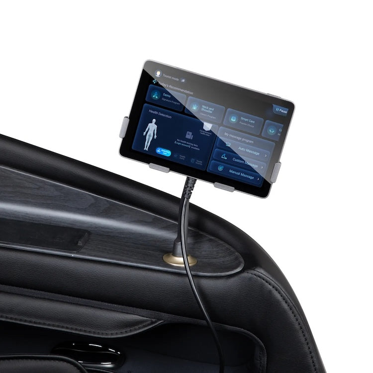 A touchscreen on a car door shows a health interface with a body diagram, connected by cable—similar to the personalized massage technology of the Osaki 4D Orion Duo Mech Massage Chair by Osaki.