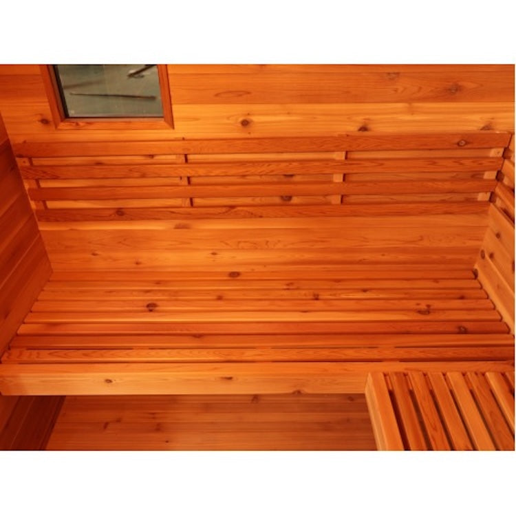 The SunRay Denali 4-Person Contemporary Outdoor Sauna by SunRay features a cozy red cedar interior, bench seating, horizontal slats, and a small window. Warm wood tones create a relaxing atmosphere for up to four people.