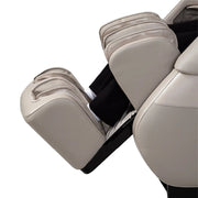 A close-up side view of the Titan Grande XL 3D Massage Chair by Titan, showing a person’s lower legs and feet in the foot and calf massage section. The chair’s ergonomic design, plush cushioning, and advanced full body massage features are visible.