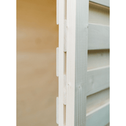 Close-up of interlocking wooden boards forming a corner joint in the Almost Heaven Timberline 6 Person Cabin Sauna, highlighting fine craftsmanship and light natural wood grain against a soft, neutral background.