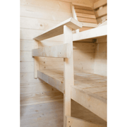 Close-up of a wooden bench inside the Almost Heaven Timberline 6 Person Cabin Sauna, highlighting its smooth, slatted design—ideal for relaxing in your spacious Almost Heaven outdoor sauna.