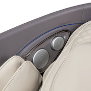 Close-up of the Osaki Flagship Duo Massage Chair by Osaki, in beige leather with quilted stitching, adjustable controls, and speaker grilles—blending luxury car seat design and advanced AI massage technology for ultimate comfort.