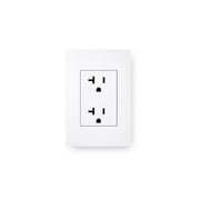 A white electrical wall outlet with dual three-pronged sockets is mounted on a plain white wall beside the Maxxus 3 Person Low EMF FAR Corner Infrared Sauna, made of Canadian Hemlock by Golden Designs.