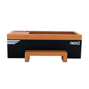 The Medical Sauna - Frozen 2 Cold Plunge by Medical Saunas features a rectangular wooden design, matching bench, black side panel, white accents, and a Frozen 2 logoāgreat for imaginative fun or cold water therapy.