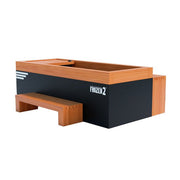 The Medical Sauna - Frozen 2 Cold Plunge by Medical Saunas is a rectangular black wooden sandbox with a built-in bench and Frozen 2 logo, inspired by the invigorating effects of cold water therapy.