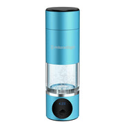The MitoHYDRO™ Ultra Premium Hydrogen Water Bottle by Mito Red Light features a blue portable design, a clear midsection showing bubbling water, a black top, and a digital display at the base reading 4:23. The brand is printed on the upper part.