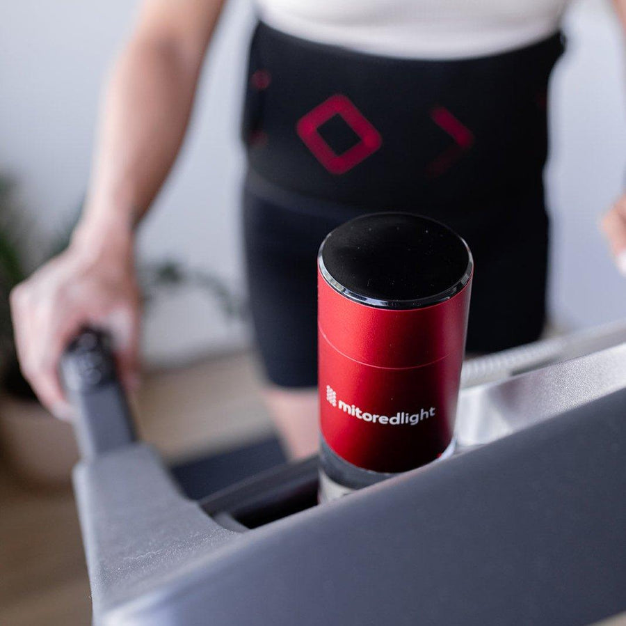A person holds the MitoHYDRO™ Ultra Premium Hydrogen Water Bottle by Mito Red Light, with their arm and torso visible, benefiting from hydrogen water.