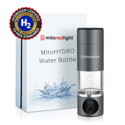 A MitoHYDRO™ Ultra Premium Hydrogen Water Bottle by Mito Red Light in Slate sits before its box, which showcases the product name and an image of antioxidant-rich hydrogen water splashing. The bottle features a digital display and certification badge.