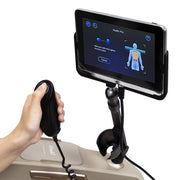 A hand holding the Osaki 4D Maestro LE 2.0 Massage Chair's touchscreen controller, highlighting advanced features like voice control and zero gravity reclining.