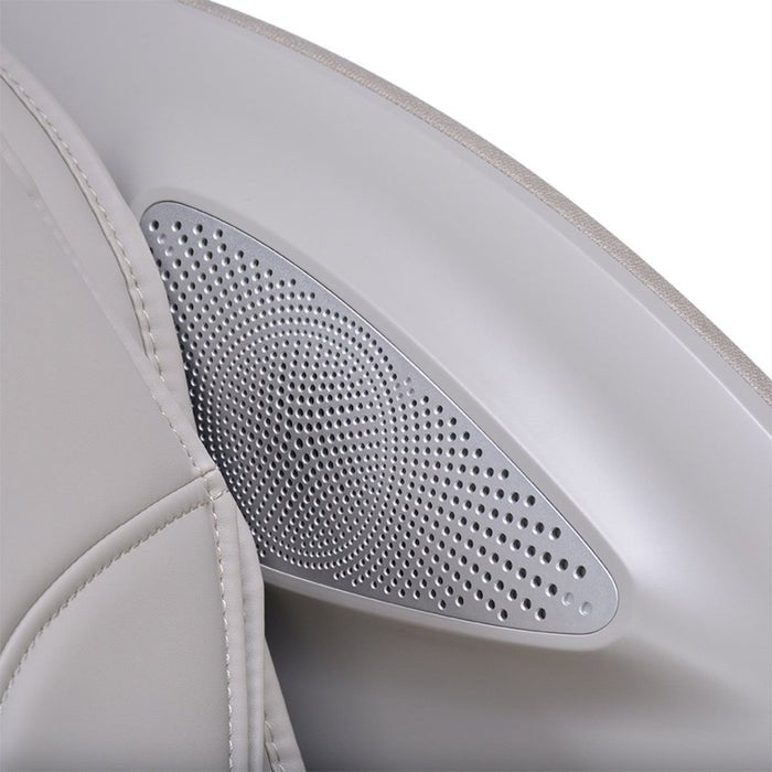 Close-up of a gray perforated speaker embedded in the armrest of the Osaki 4D Manhattan Duo Mech massage chair by Osaki, featuring light gray leather and advanced AI massage technology designed for superior comfort.