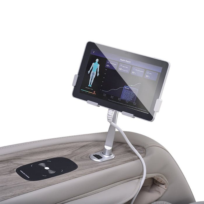 A tablet showing a health report is mounted on the light-colored armrest of the Osaki 4D Manhattan Duo Mech massage chair, which features a built-in wireless charging pad and a cable connecting the tablet.