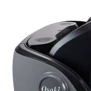 Close-up of the Osaki OP-4D Master massage chair, highlighting advanced 4D massage mechanism and integrated Bluetooth speakers.