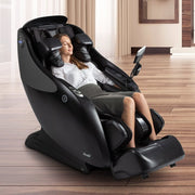 A woman relaxing in an Osaki OP-4D Master massage chair, showcasing advanced features like zero gravity reclining and shoulder massage.