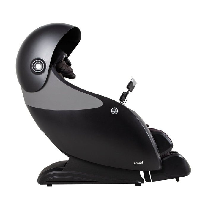 The Osaki OP-Ai Xrest 4D+ Massage Chair by Osaki features a sleek black, capsule-inspired design with an overhead dome, padded armrests, mounted control panel, and advanced Ai Series Technology. The Osaki logo is displayed near the front base.