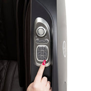 A close-up of a hand using the touchscreen controller of the Osaki OP-Ai Xrest 4D+ Massage Chair.