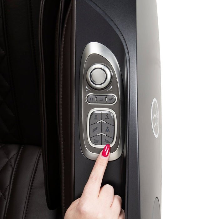 A hand with red nail polish presses a button on the Osaki OP-Ai Xrest 4D+ Massage Chair's control panel, which is built into the armrest of the luxurious quilted leather chair by Osaki and features several buttons, a dial, and advanced Ai Series Technology.