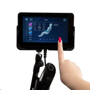 A hand using a touchscreen controller for the Osaki OP-Ai Xrest 4D+ Massage Chair.
