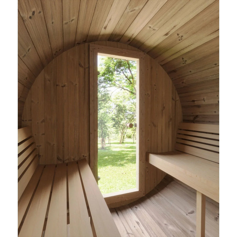 Interior of the SaunaLife Model E7W 4 Person Sauna Barrel-Window by SaunaLife, showcasing ergonomic curved wooden walls and benches with a tall rectangular window framing views of green grass and trees.