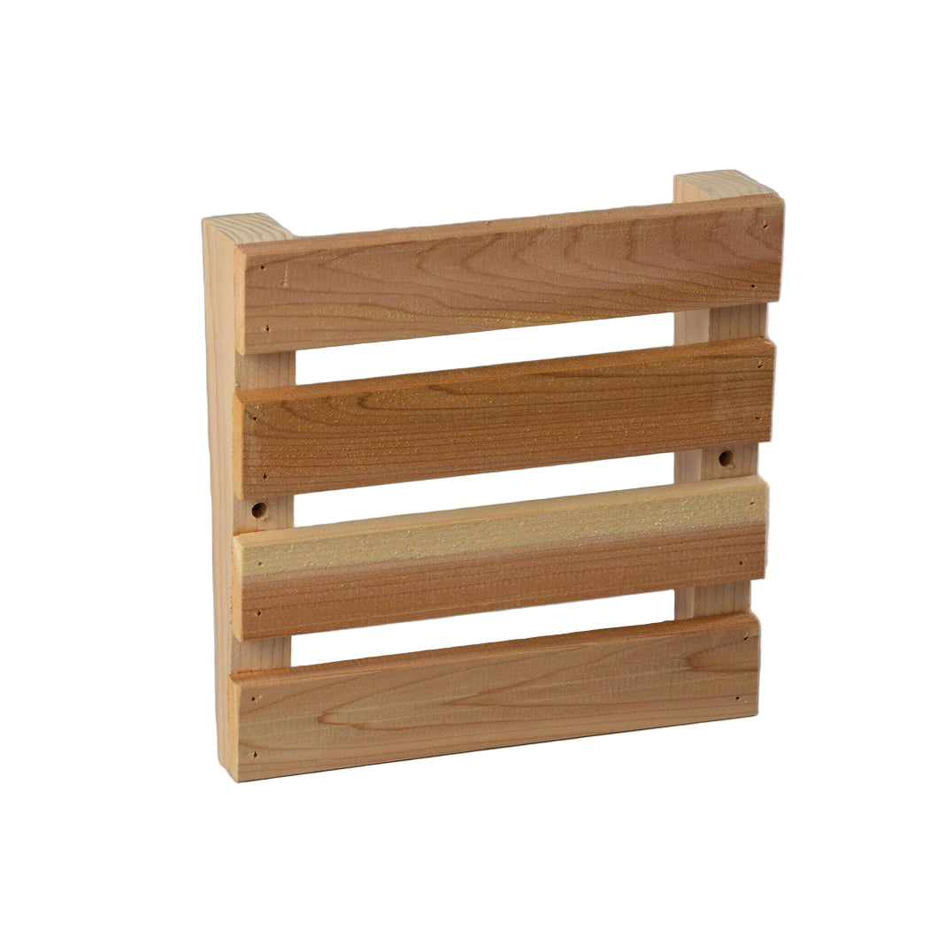 The Almost Heaven Sauna Magazine Rack by Almost Heaven features unfinished red cedar with three horizontal slats and two side supports—ideal as a rustic sauna accessory or unique magazine holder.