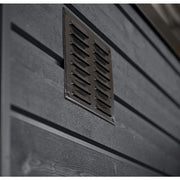 A close-up of a rectangular metal vent with slats on the dark grey wood exterior of the SaunaLife G6 5-Person Outdoor Cabin Sauna, enhancing ventilation and style for this luxurious SaunaLife sauna.