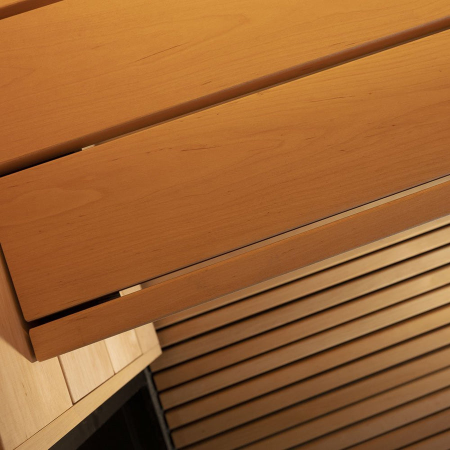 Close-up of light wood drawers and slatted panels in the SaunaLife G6 5-Person Outdoor Cabin Sauna, showcasing its modern minimalist style, natural grain, and expert craftsmanship by SaunaLife.