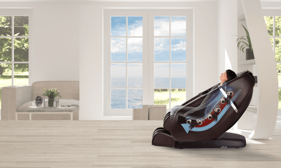 A person relaxes in the Daiwa Majesty Massage Chair by Daiwa, enjoying soothing massage flows in a bright living room with ocean views, while advanced 3D body scan technology delivers a personalized experience.
