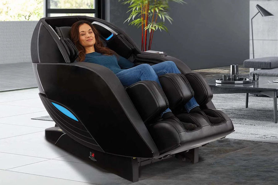 A woman relaxes in a bright, modern living room, enjoying a soothing massage in the Kyota Yutaka M898 Massage Chair by Kyota, surrounded by minimalist decor.