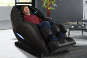 A man sleeping in a Kyota Yutaka M898 Massage Chair, showcasing its ergonomic design and advanced massage technology.