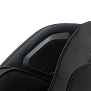 Close-up of the Osaki 4D YogaFlex Massage Chair by Osaki, showing a black padded headrest with a mesh-covered built-in speaker, part of its advanced SL-Track 4D massage system.
