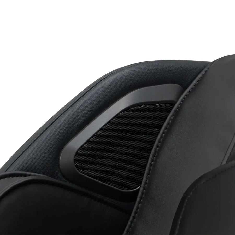 Close-up of the Osaki 4D YogaFlex Massage Chair by Osaki, showing a black padded headrest with a mesh-covered built-in speaker, part of its advanced SL-Track 4D massage system.
