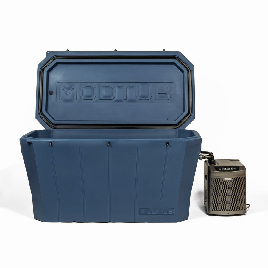 The Modtub 2.0 - Cold Plunge System by Modtub features a large blue rectangular tub with an open lid, connected by a hose to a compact digital control unit beside it, all shown on a white background.