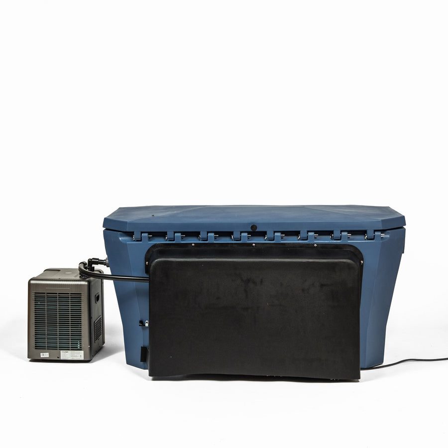 A blue rectangular tub with the Modtub 2.0 Vanity Cover by Modtub attached to the front, connected via hose to a compact gray cooling unit on the left for pump concealment, all displayed against a plain white background.