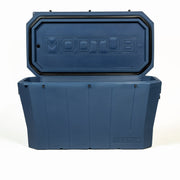 A large, blue Modtub 2.0 Cold Plunge tub by Modtub is shown with its lid open, revealing a spacious interior. The rectangular plastic build is sturdy and features a subtle geometric design on the front.