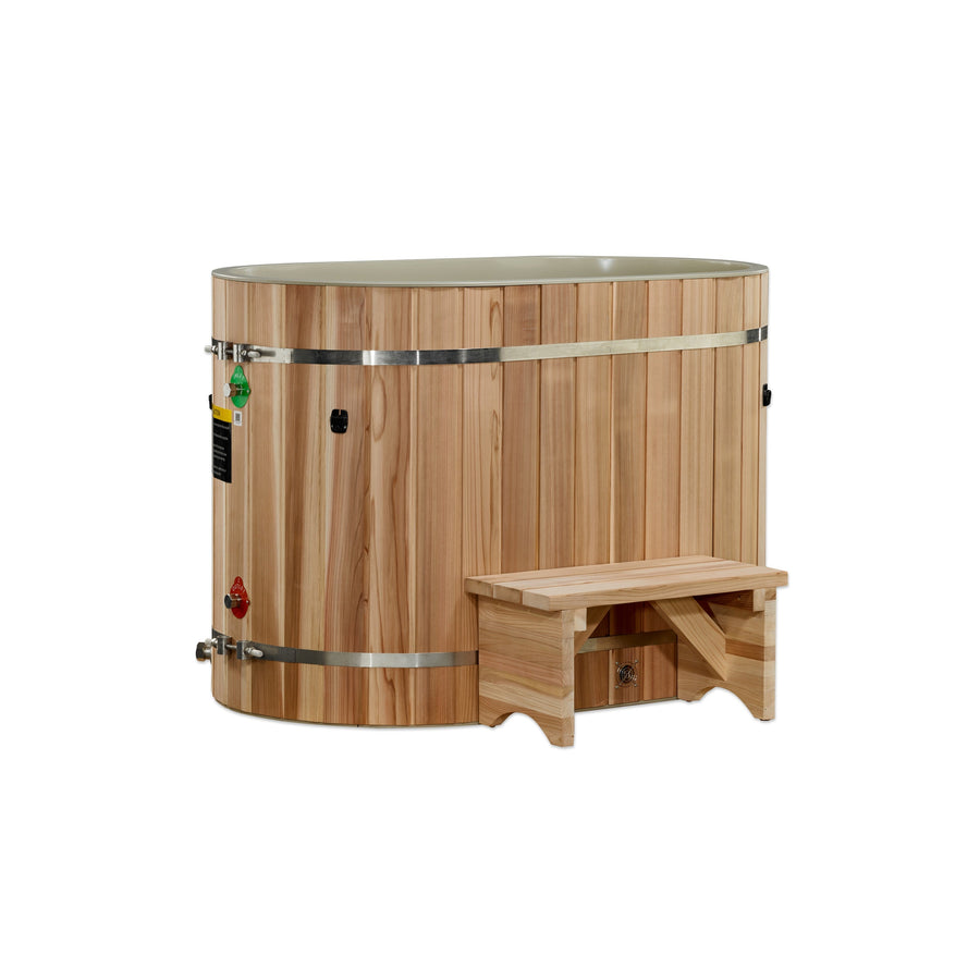 The Dynamic Cold Therapy Oval Barrel Tub Cold Plunge (50-P) Pacific Cedar by Golden Designs - Dynamic Cold Therapy features a natural wood finish, metal bands, and a matching step stool—ideal for cold plunge therapy and muscle recovery. Shown on white background.