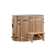 The Golden Designs Dynamic Cold Therapy Oval Barrel Tub Cold Plunge (50-P) in Pacific Cedar features metal bands and a matching step stool—ideal for muscle recovery or cold plunge pools—shown against a plain white background.