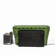 A large green Modtub 2.0 Vanity Cover by Modtub, featuring a black lid and connected via cable to a small gray electronic device on the left, discreetly conceals a pump against a plain white background.