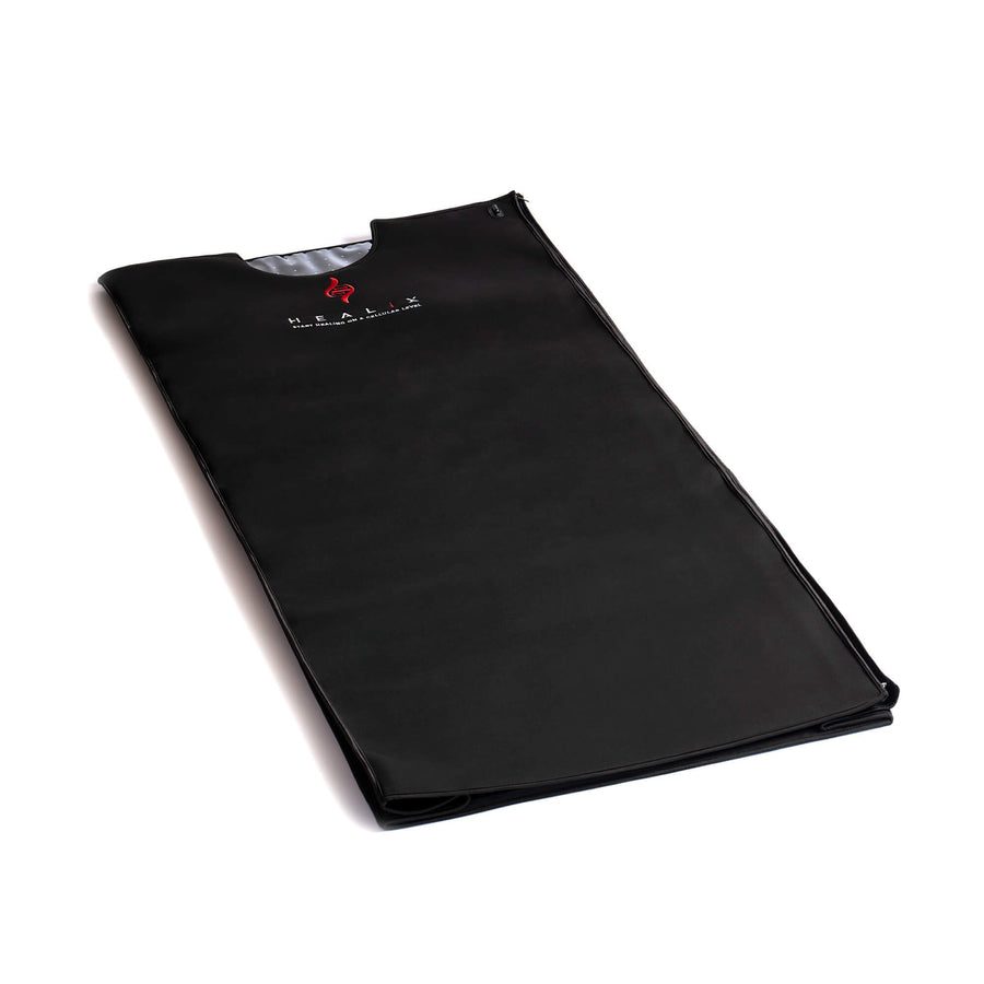 The HEALiX Glow Pod by HEALiX Infrared is a black, rectangular sauna blanket with a top cutout and a red flame logo with white text at the upper center, shown on a white background.