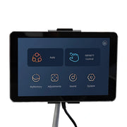 A touchscreen tablet on a stand shows the Infinity Imperial Syner-D Massage Chair control panel by Infinity, with Flex-Track and Syner-D Technology options: Auto, Infinity Control, MyMemory, Adjustments, Sound, System, and a power button icon at top right.
