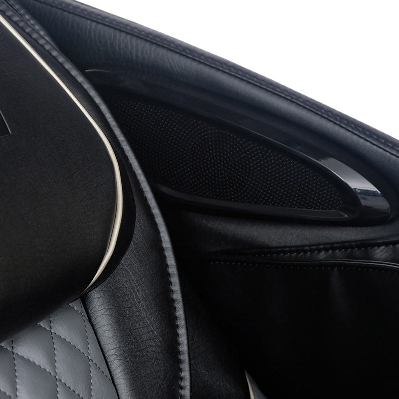 Close-up of a car's black leather interior with quilted stitching and a door panel speaker—elegance that rivals the comfort of the Kyota Kizuna M688 Massage Chair by Kyota.